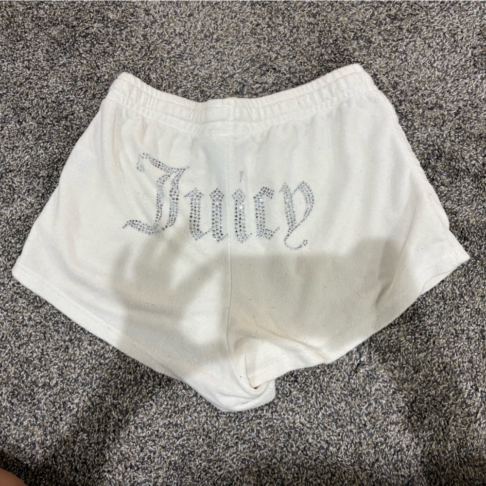 Juicy Couture white shorts with silver rhinestone logo.
